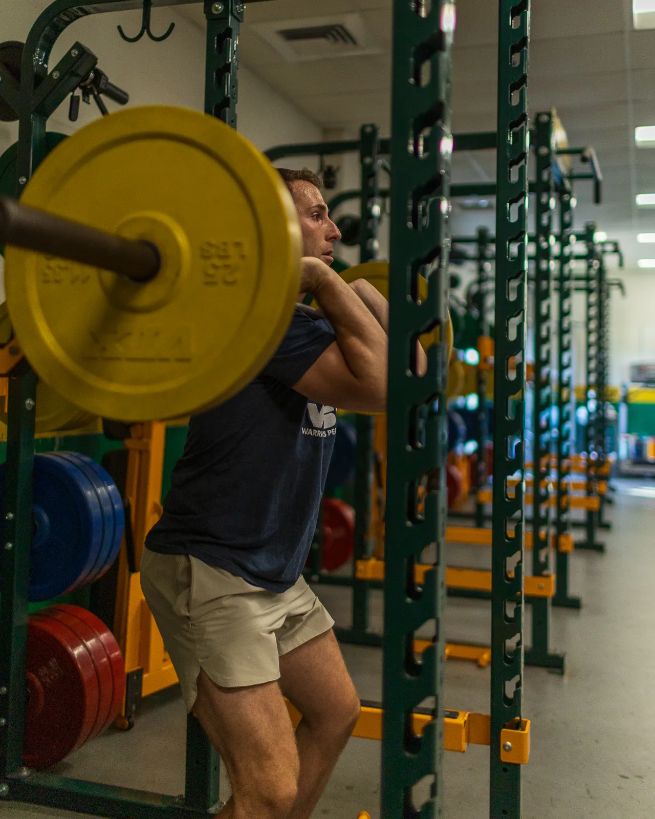 Athlete practicing a barbell squat
