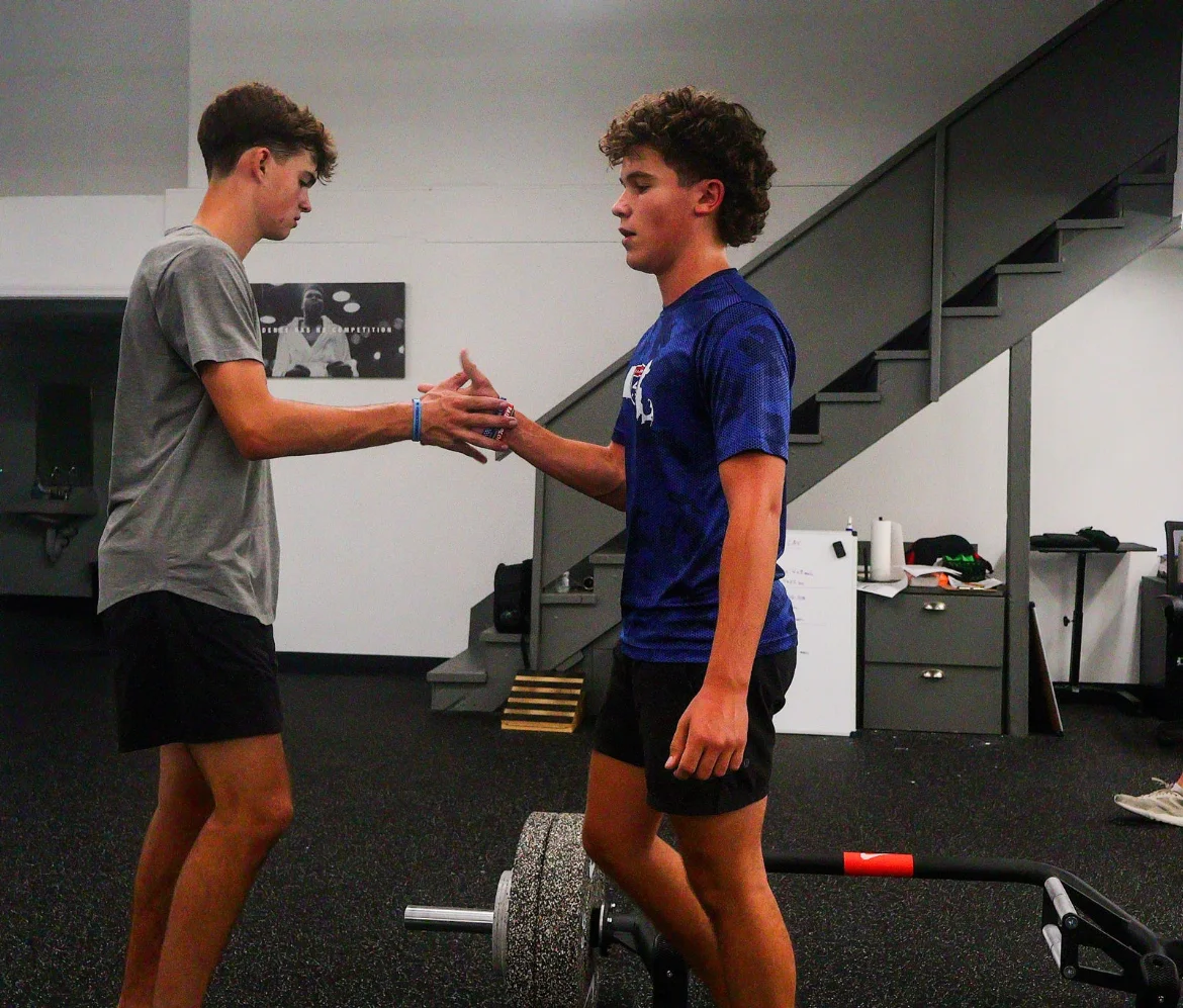 Two athletes sharing a high-five at WSP