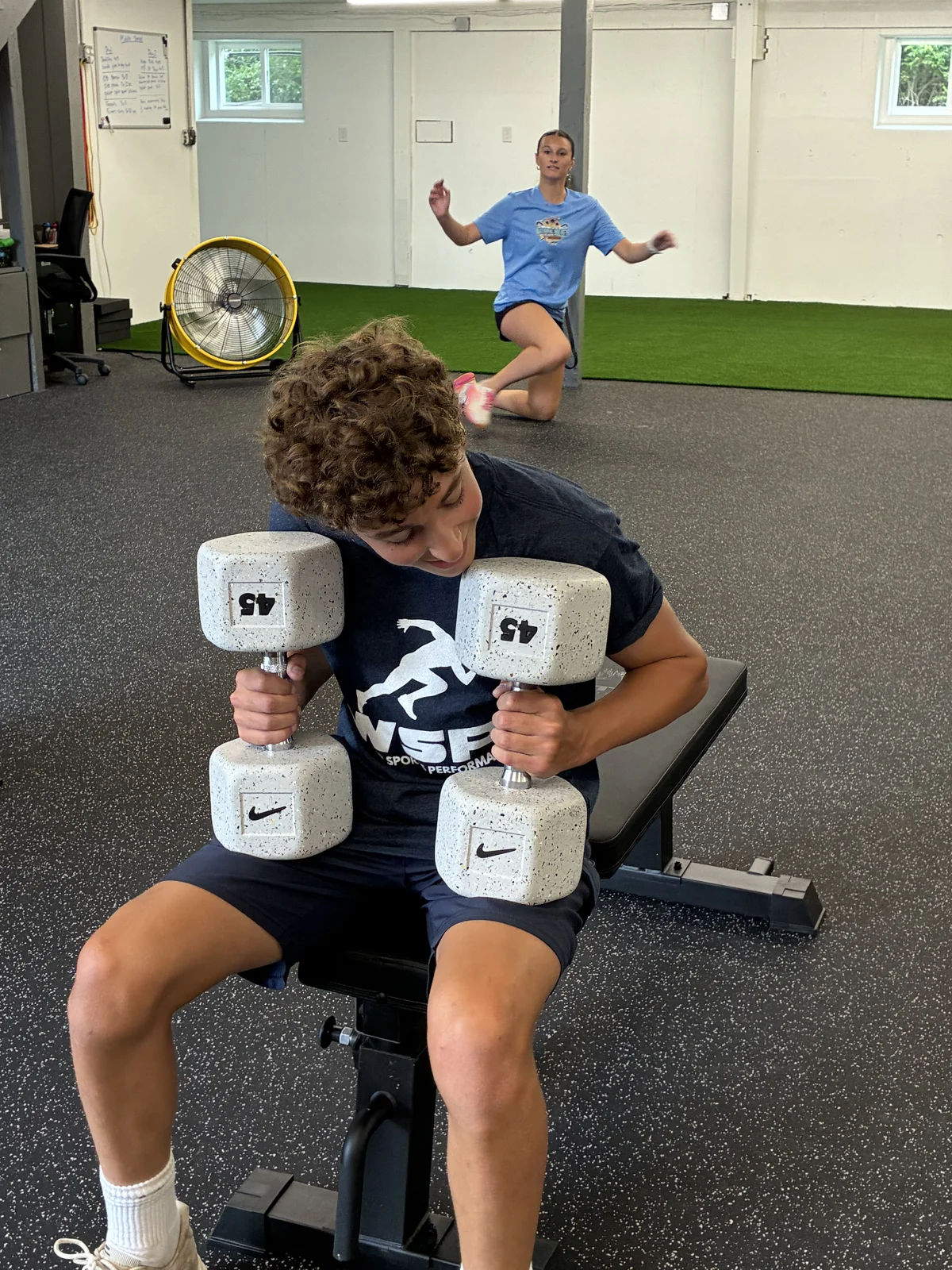 Athlete performing a dumbbell row at WSP