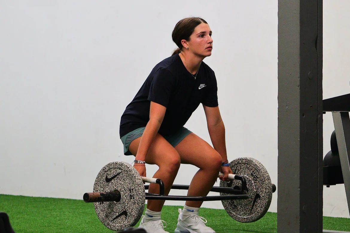 Athlete performing a trap-bar deadlift at Warrior Sports Performance