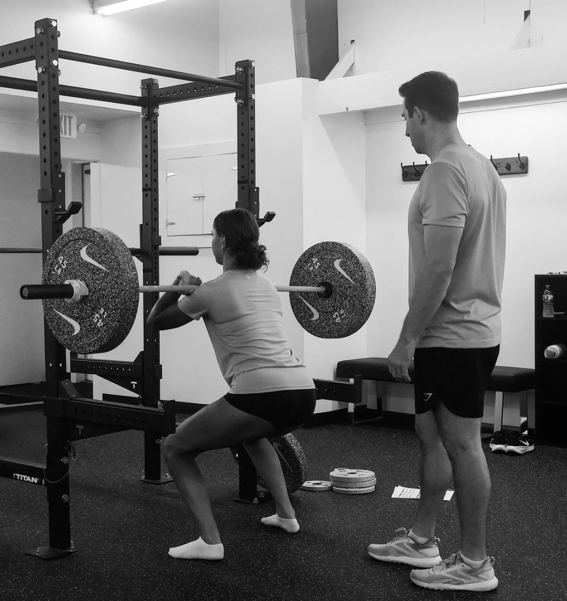 WSP coach observing an athlete performing a front squat
