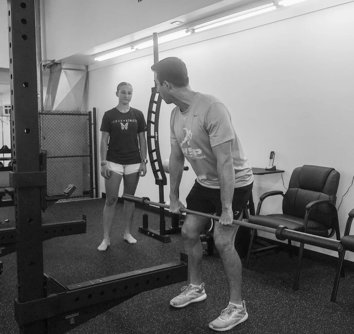 Coach supervising a trap-bar lift at WSP